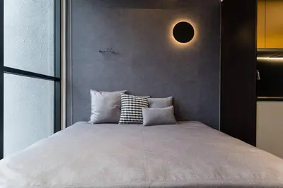a bedroom with a large bed with pillows on it at KLCC ModernMusicalSuite AT ScarletzSuites in Kuala Lumpur