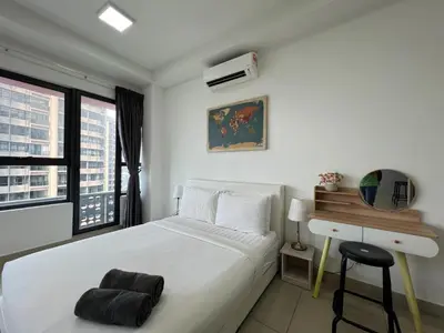 a white bedroom with a bed and a desk at Arte plus by Sweet home in Kuala Lumpur