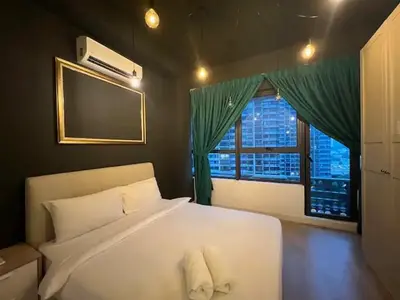 a bedroom with a large white bed and a window at Arte plus by Sweet home in Kuala Lumpur