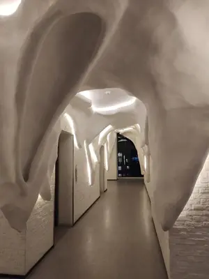 a hallway with white walls and an archway at Arte plus by Sweet home in Kuala Lumpur