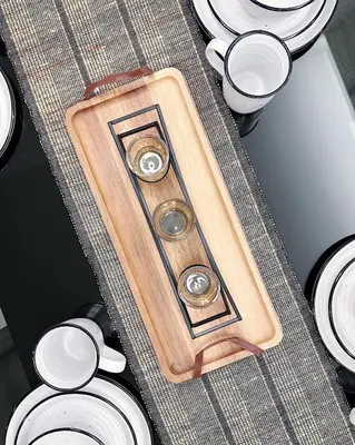 a wooden cutting board sitting next to a pile of toilets at Tropicana The Residence suites by VV Homestay KLCC in Kuala Lumpur