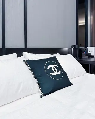 a black and white pillow on top of a bed at Tropicana The Residence suites by VV Homestay KLCC in Kuala Lumpur