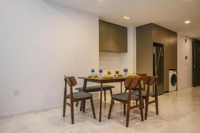 a kitchen and dining room with a table and chairs at Eaton Residence KLCC Skyline in Kuala Lumpur