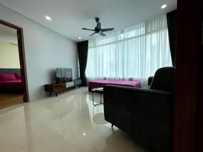 a living room with a couch and a ceiling fan at Vortex Suites KLCC by C&C Fortune in Kuala Lumpur