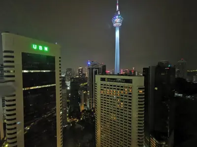 a view of a city at night with the cn tower at Vortex Suites KLCC by C&C Fortune in Kuala Lumpur