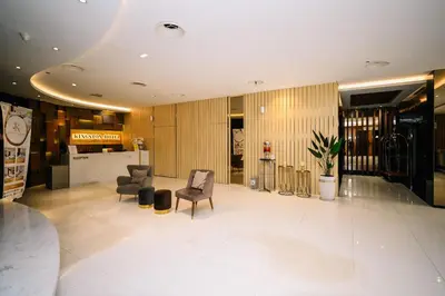 a lobby with two chairs and a table at Kingston Hotel 5 - Chow Kit in Kuala Lumpur