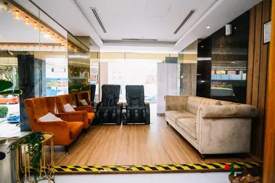 a lobby with couches and chairs in a store at Kingston Hotel 5 - Chow Kit in Kuala Lumpur
