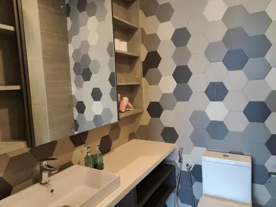 a bathroom with a sink and a mirror at Ceylonz Suites in Kuala Lumpur