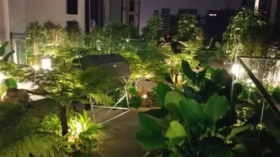 a garden at night with plants and lights at MCity Ampang, KL in Kuala Lumpur