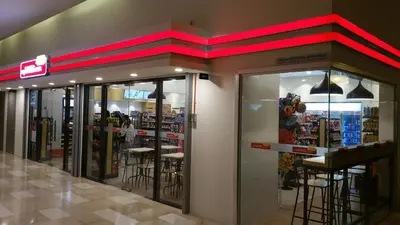 a store with stools inside of a store at MCity Ampang, KL in Kuala Lumpur