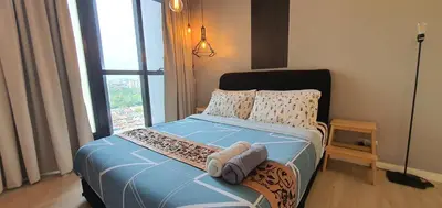 a small bedroom with a bed with towels on it at MCity Ampang, KL in Kuala Lumpur