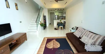 a living room with a couch and a flat screen tv at MCity Ampang, KL in Kuala Lumpur
