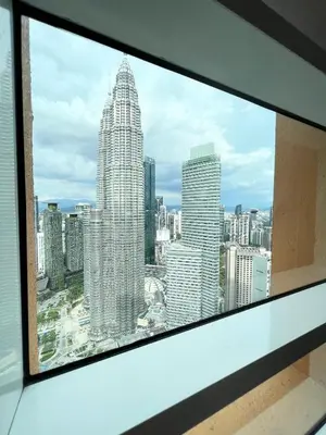 a view of a city skyline from a window at Sky Suites KLCC by PNUT in Kuala Lumpur