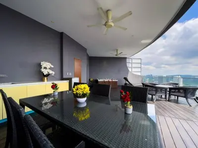 a dining room with a table with flowers on it at The Luxury Penthouses KLCC Petronas Twin tower Kuala Lumpur in Kuala Lumpur