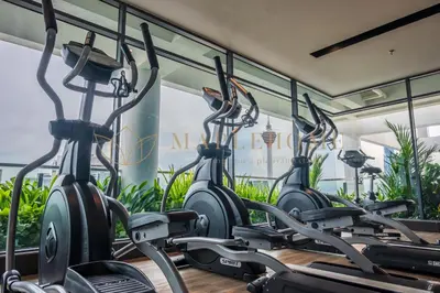 a row of exercise bikes in a gym at The Colony and The Luxe Premier Suites Kuala Lumpur in Kuala Lumpur