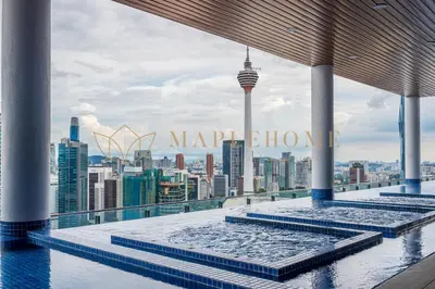 a swimming pool on the roof of a building with a view of the city at The Colony and The Luxe Premier Suites Kuala Lumpur in Kuala Lumpur