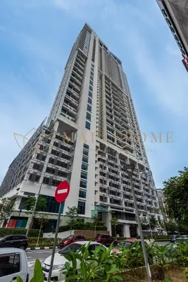 a tall building with cars parked in front of it at The Colony and The Luxe Premier Suites Kuala Lumpur in Kuala Lumpur