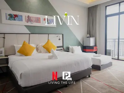 a hotel room with two beds and a sign living the life at #16 M101 Dang Wangi KLCC View Pool By Livin in Kuala Lumpur