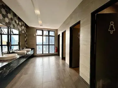 a large bathroom with two sinks and two mirrors at #16 M101 Dang Wangi KLCC View Pool By Livin in Kuala Lumpur