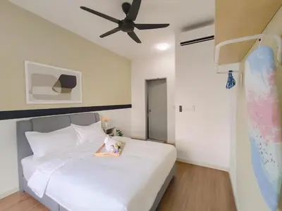 a bedroom with a white bed with a toy on it at M Vertica By Minsu in Kuala Lumpur
