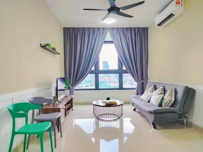a living room with a couch and a table at M Vertica By Minsu in Kuala Lumpur