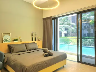 a bedroom with a large bed and a large window at M city service suite KLCC in Kuala Lumpur
