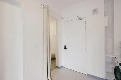 a bathroom with a mirror and a white closet at Muji Home 2BR 4Pax Southlink Nexus Bangsar South in Kuala Lumpur
