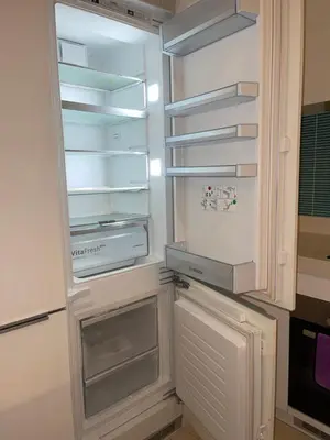 an empty refrigerator with its door open in a kitchen at Tropicana The Residences By RS in Kuala Lumpur