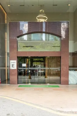 a building with a large glass door in front of it at Bangsar Trade Centre by Airhost in Kuala Lumpur