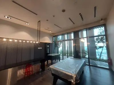 a large room with a table and a large window at Tropicana The Residence Klcc By Sky World in Kuala Lumpur