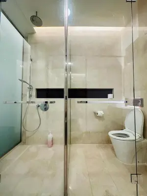 a bathroom with a shower and a toilet at Tropicana The Residence Klcc By Sky World in Kuala Lumpur