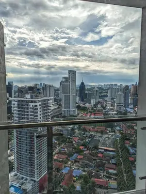 a view of a city from a window of a building at Legasi 3-bedroom condo - 5 mins walk to KLCC in Kuala Lumpur
