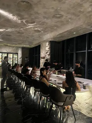 a group of people sitting at tables in a room at Star Sky Park KLCC in Kuala Lumpur