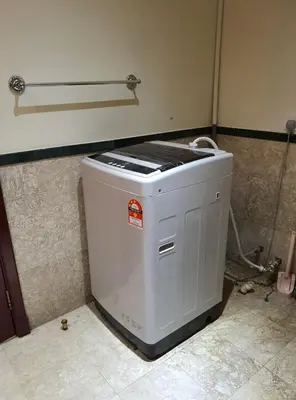 a small appliance sitting on the floor in a room at Homestay Heart of Bukit Bintang Walk to Monorail & LRT St by Cloud Host in Kuala Lumpur