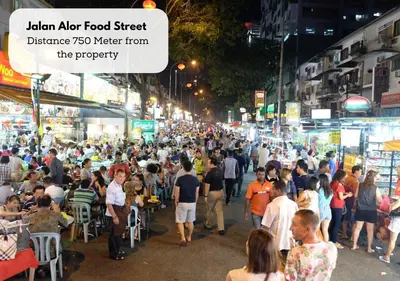 a crowd of people walking down a street at night at Homestay Heart of Bukit Bintang Walk to Monorail & LRT St by Cloud Host in Kuala Lumpur