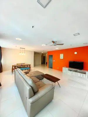 a living room with a couch and a table at Summer Suites by Moon Orchid in Kuala Lumpur