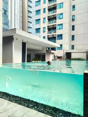 a swimming pool in front of a building at Summer Suites by Moon Orchid in Kuala Lumpur