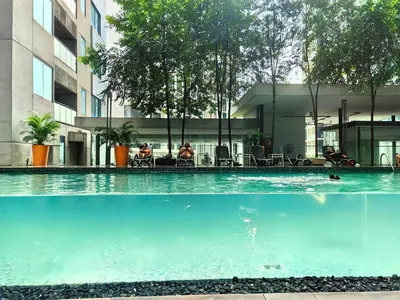 a swimming pool in front of a building at Summer Suites by Moon Orchid in Kuala Lumpur