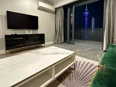 a living room with a tv and a couch at The Platinum 2 Kuala Lumpur by HOLMA in Kuala Lumpur