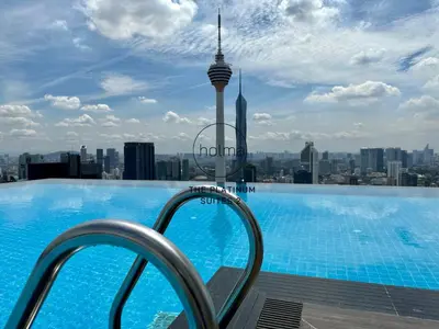a swimming pool on the roof of a building with a view of the city at The Platinum 2 Kuala Lumpur by HOLMA in Kuala Lumpur