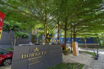 a sign in front of a museum with trees at Maxhome Premium at Dorsett Bukit Bintang in Kuala Lumpur