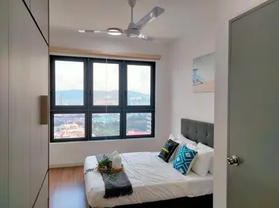 a bedroom with a bed with a large window at M Vertica Residence I HomeBrickz in Kuala Lumpur