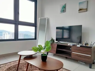 a living room with a tv and a coffee table at M Vertica Residence I HomeBrickz in Kuala Lumpur