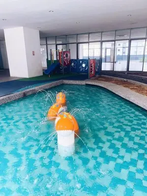 a swimming pool with an orange buoy in the water at [PROMO]Connected train 2 Bedroom ABOVE MALL (22) in Kuala Lumpur