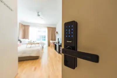 a room with a door handle with a bedroom at MITEC Publika 500Mbp Wi-fi Studio Mont Kiara Hartamas in Kuala Lumpur