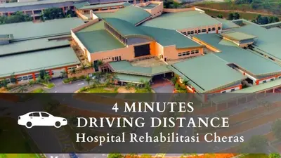 a picture of a hospital with a white car parked in front at Smile Hotel Cheras Sri Permaisuri in Kuala Lumpur