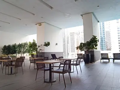 a dining room with tables and chairs in a building at RM020 Bukit Bintang 118 Tower Balcony View in Kuala Lumpur