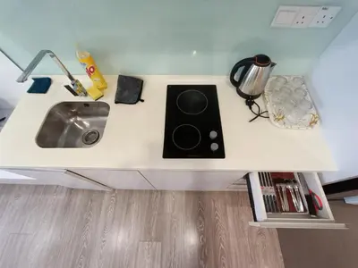 a kitchen counter with a sink in a room at RM020 Bukit Bintang 118 Tower Balcony View in Kuala Lumpur