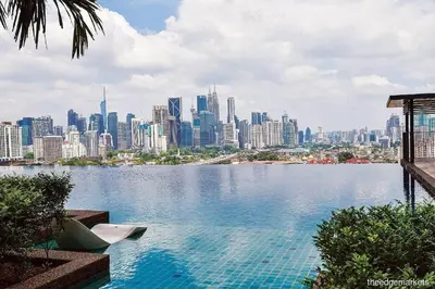 a large body of water with a city in the background at Studio near KLCC and LRT with superb view in Kuala Lumpur