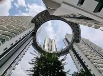 a mirror on the side of a building with a tree at Studio near KLCC and LRT with superb view in Kuala Lumpur